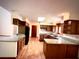 Spacious kitchen with hardwood floors, granite countertops, and ample cabinet storage at 116 Capt Anthony White Ln., Georgetown, SC 29440