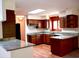 Traditional kitchen with hardwood floors, granite countertops, and stylish dark wood cabinetry at 116 Capt Anthony White Ln., Georgetown, SC 29440