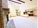 Spacious living room with vaulted ceiling, exposed beams, brick fireplace, and open to a kitchen at 116 Capt Anthony White Ln., Georgetown, SC 29440