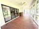 Sun room features large sliding glass doors to bring the outside in and a ceiling fan for comfort at 116 Capt Anthony White Ln., Georgetown, SC 29440