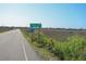 Pawleys Island town limit sign with a scenic view of marshland and vegetation on a sunny day at 118 Goodson Loop, Pawleys Island, SC 29585