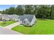 Aerial view of a well-maintained home with a manicured lawn and landscaping, showcasing its curb appeal at 120 River Country Dr., Conway, SC 29526