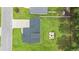 Aerial view of a home featuring a backyard firepit, fenced yard, and well-maintained landscaping at 120 River Country Dr., Conway, SC 29526