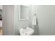 Powder room featuring a pedestal sink, framed mirror, and silver towel ring at 120 River Country Dr., Conway, SC 29526