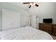 Bedroom featuring a large bed, TV, and private entry to bathroom at 120 River Country Dr., Conway, SC 29526