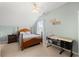 Bright bedroom with ceiling fan, a double bed, and a writing desk by the window at 120 River Country Dr., Conway, SC 29526