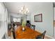 Dining room featuring an elegant chandelier, dining table and access to the living room at 120 River Country Dr., Conway, SC 29526