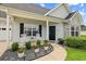 Inviting front porch featuring a walkway and decorative plants at 120 River Country Dr., Conway, SC 29526