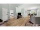 Open-concept living space with wood floors and ample natural light flowing into multiple rooms at 120 River Country Dr., Conway, SC 29526