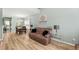 Open-concept living and dining area with wood floors and a large dining table at 120 River Country Dr., Conway, SC 29526
