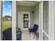 Relaxing screened porch featuring comfortable blue cushioned chairs and a view of the outdoors at 120 River Country Dr., Conway, SC 29526