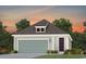 Detached garage with carriage door nestled among trees in a well-maintained community at 1217 Lady Bird Way, North Myrtle Beach, SC 29582
