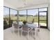 Covered patio featuring an outdoor dining set with views of the expansive green lawn at 1217 Lady Bird Way, North Myrtle Beach, SC 29582