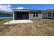 Backyard featuring a screened-in porch, showcasing a great outdoor living space at 1225 Lady Bird Way, North Myrtle Beach, SC 29582
