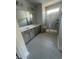 Bathroom featuring a double vanity and glass-enclosed shower at 1225 Lady Bird Way, North Myrtle Beach, SC 29582