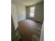 Bedroom with vinyl flooring, window, and neutral walls, offering a clean and customizable space at 1225 Lady Bird Way, North Myrtle Beach, SC 29582
