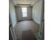 Bright bedroom with tray ceiling, vinyl flooring, and neutral walls, ready for personalization at 1225 Lady Bird Way, North Myrtle Beach, SC 29582