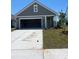 Charming single-story home featuring a spacious two-car garage and well-maintained front lawn at 1225 Lady Bird Way, North Myrtle Beach, SC 29582