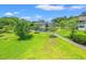 Green lawn space with a community lake and several condo units in a residential neighborhood at 1415 Powhaton Dr., Myrtle Beach, SC 29577