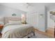 Comfortable bedroom with a ceiling fan, ample natural light, and neutral decor at 1415 Powhaton Dr., Myrtle Beach, SC 29577