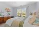 Charming bedroom features a ceiling fan, natural light, and relaxing neutral decor at 1415 Powhaton Dr., Myrtle Beach, SC 29577