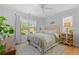 Serene bedroom featuring a ceiling fan, natural light from the window, and warm decor at 1415 Powhaton Dr., Myrtle Beach, SC 29577