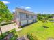 Beautiful two story home features a manicured lawn, well-maintained landscape, and long driveway at 1415 Powhaton Dr., Myrtle Beach, SC 29577