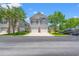 Charming two-story home with a two-car garage, a well-maintained lawn, and attractive curb appeal at 1415 Powhaton Dr., Myrtle Beach, SC 29577