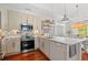 Bright kitchen featuring white cabinets, stainless steel appliances, and an open layout at 1415 Powhaton Dr., Myrtle Beach, SC 29577