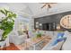 Bright living room with a cozy seating area, vaulted ceiling, and hardwood floors at 1415 Powhaton Dr., Myrtle Beach, SC 29577