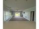 Open-concept living room with access to the patio and kitchen at 1514 Lanterns Rest Dr. # 103, Myrtle Beach, SC 29579