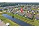 Aerial showcases backyard water feature and screened in back porch at 1725 Boyne Dr., Myrtle Beach, SC 29588