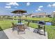 Backyard patio features outdoor seating, grill, and a peaceful view of the water at 1725 Boyne Dr., Myrtle Beach, SC 29588