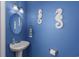 Bathroom with a unique, nautical themed decor and blue walls, sink, and light fixture at 1725 Boyne Dr., Myrtle Beach, SC 29588