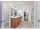 Bathroom with walk-in closet, vanity with double sinks and walk-in shower at 1725 Boyne Dr., Myrtle Beach, SC 29588