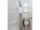Bright bathroom includes a shower and tub combo with a patterned curtain and a nearby window at 1725 Boyne Dr., Myrtle Beach, SC 29588