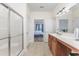 Bathroom with double vanity, shower and doorway to primary bedroom at 1725 Boyne Dr., Myrtle Beach, SC 29588
