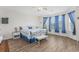 Primary bedroom with wood-look floors and large windows at 1725 Boyne Dr., Myrtle Beach, SC 29588
