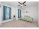 Spacious bedroom features neutral carpeting, a ceiling fan, and a large window at 1725 Boyne Dr., Myrtle Beach, SC 29588