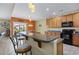 Eat-in kitchen featuring granite countertops, stainless appliances, ample cabinetry, and barstool seating at 1725 Boyne Dr., Myrtle Beach, SC 29588