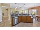 Open kitchen area with granite counters, stainless appliances, breakfast bar and adjacent dining at 1725 Boyne Dr., Myrtle Beach, SC 29588