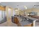 Open kitchen design with granite counters and stainless steel refrigerator at 1725 Boyne Dr., Myrtle Beach, SC 29588