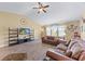 Comfortable living room with a vaulted ceiling, ceiling fan, entertainment center, and hardwood floors at 1725 Boyne Dr., Myrtle Beach, SC 29588