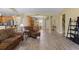 Open-concept living area seamlessly connects with the kitchen and dining, featuring hardwood floors and ample lighting at 1725 Boyne Dr., Myrtle Beach, SC 29588