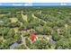 An aerial view shows the community and its location near the golf course and surrounding trees at 1788 Club Circle, Pawleys Island, SC 29585