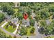 Aerial shot of a beautiful home nestled among lush trees, with a well-manicured yard at 1788 Club Circle, Pawleys Island, SC 29585