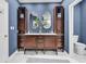 Spacious bathroom boasting dual vanities, white marble floors and modern fixtures at 1788 Club Circle, Pawleys Island, SC 29585