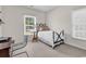 Well-lit bedroom with a single bed, desk and large windows at 1788 Club Circle, Pawleys Island, SC 29585
