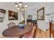 Elegant dining room with hardwood floors that seamlessly flow into the living and dining areas, enhancing the home's appeal at 1788 Club Circle, Pawleys Island, SC 29585