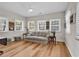 Comfortable living room featuring a neutral color palette, multiple windows, and hardwood floors, offering a relaxing space at 1788 Club Circle, Pawleys Island, SC 29585